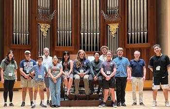 Instructors Eugene Lavery and Jens Korndörfer with the nine camp students and two councilors
