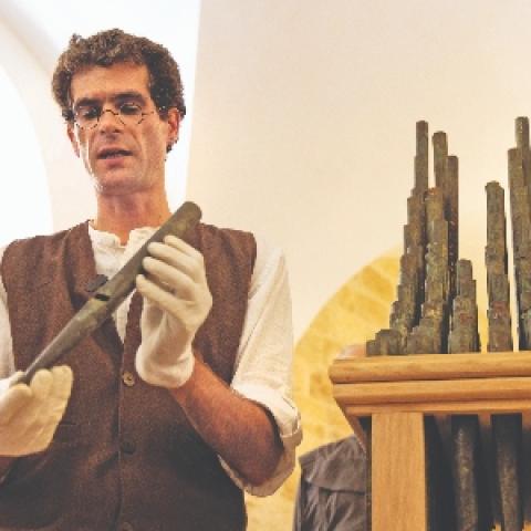 David Catalunya carefully presents a pipe from the Organ of Bethlehem